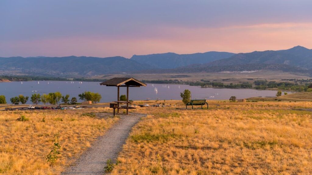 A Summer sunset view of a quiet picnic area at top of Chatfield Dam, Chatfield State Park, Denver-Littleton, Colorado, USA
